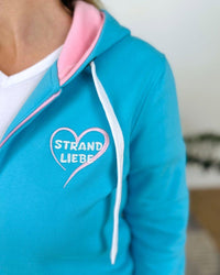 Herzlein_Sweatjacke_Strand_Meer_Sonne_in_Himmelblau