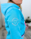 Herzlein_Sweatjacke_Strand_Meer_Sonne_in_Himmelblau